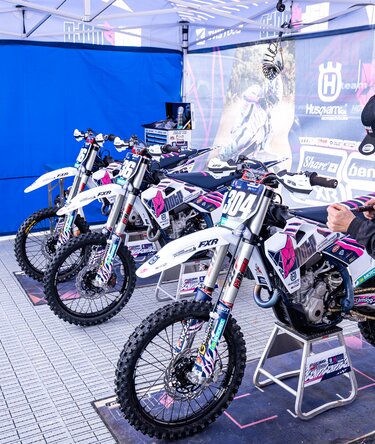 Race bikes under Ecotent pop-up gazebos.